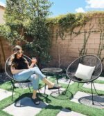 The weather-resistant garden furniture set made of PE rattan and glass, perfect for outdoor use.